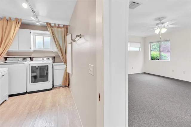 a view of bathroom with a toilet sink and a mirror