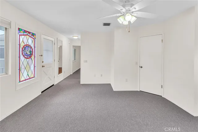 a view of a backyard with porch and garden