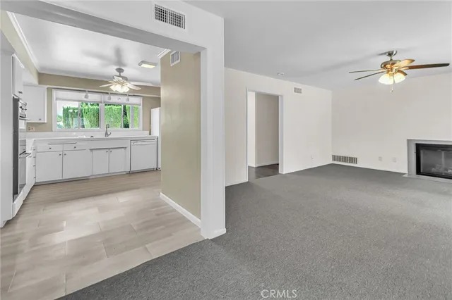 a view of a kitchen with a sink and dishwasher with kitchen view