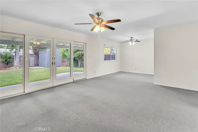 a view of an empty room with a balcony
