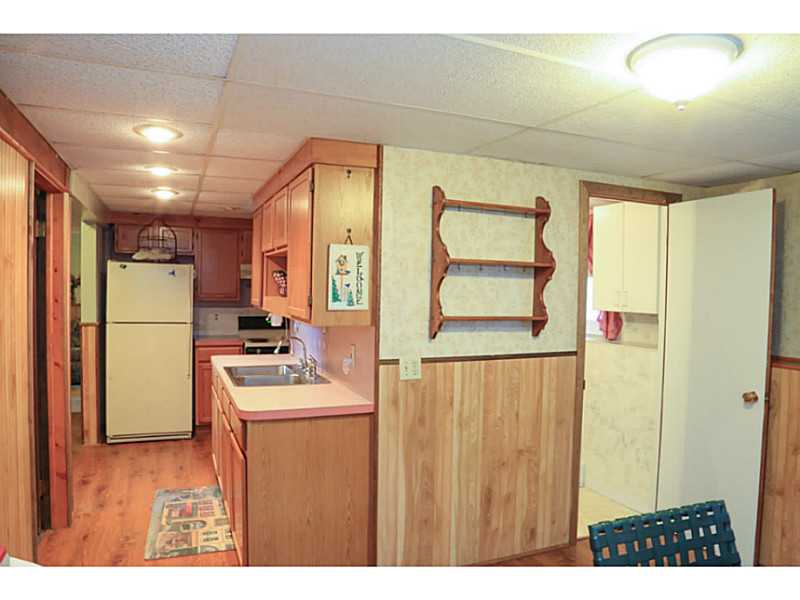 148 Alder Road Charlestown, RI 02813 - Photo 16 of 18 Kitchen. This second kitchen is in good shape. This property has a complete walkout inlaw suite with full bath and bedroom, separate dining and den in the lower level.