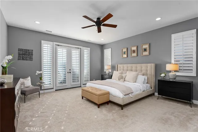 a spacious bedroom with a bed and a window