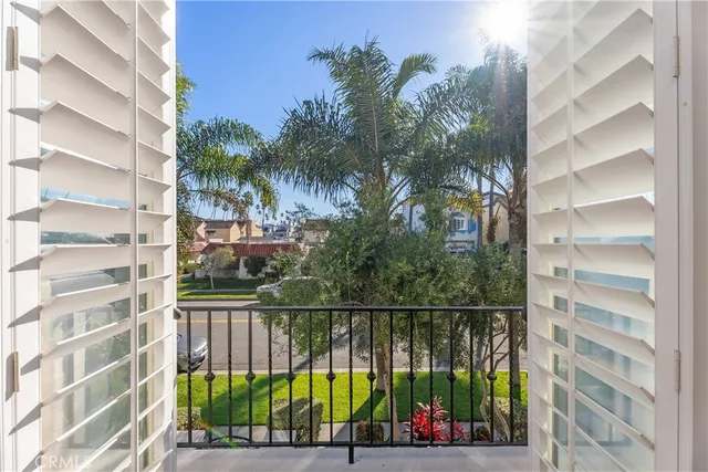 a view of a balcony with potted plants