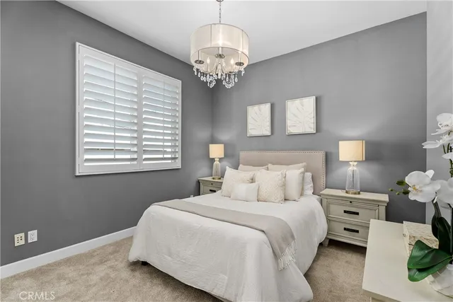 a bedroom with bed and a window