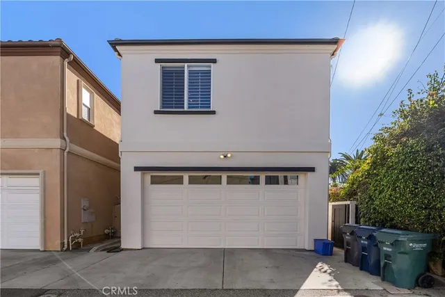 a front view of a house with garage