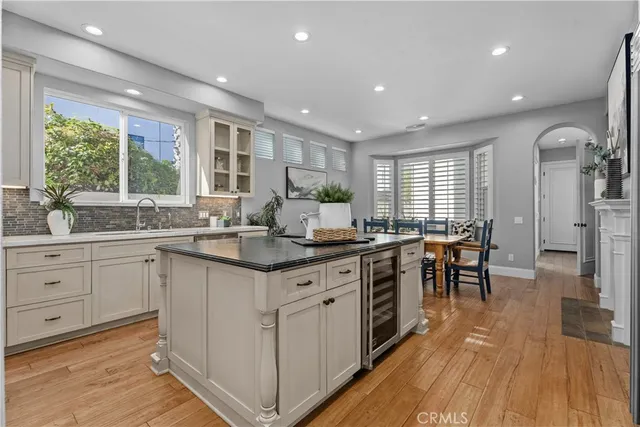 a kitchen with sink stove and cabinets