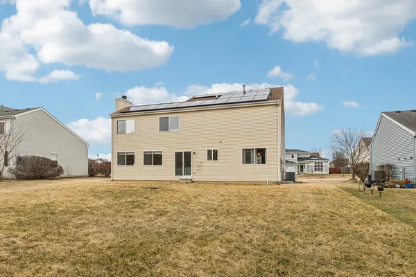a view of a house with backyard