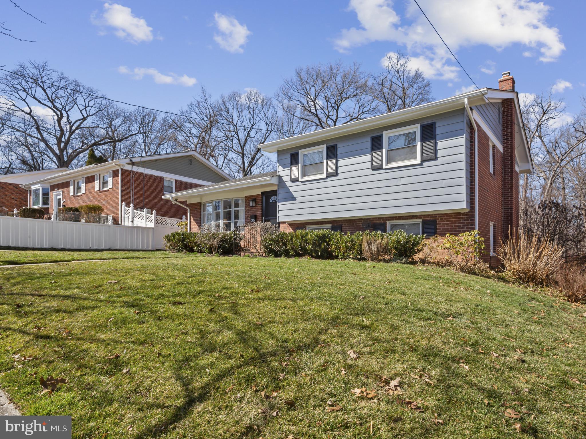 935 Loxford Terrace Silver Spring, MD 20901 - Photo 3 of 42 a front view of a house with garden