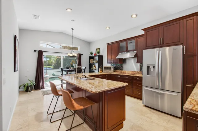 a view of a livingroom with furniture and a flat screen tv