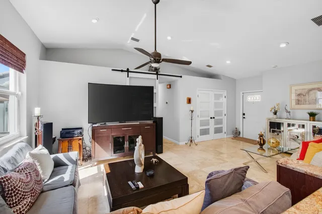 a kitchen with granite countertop wooden cabinets and white appliances