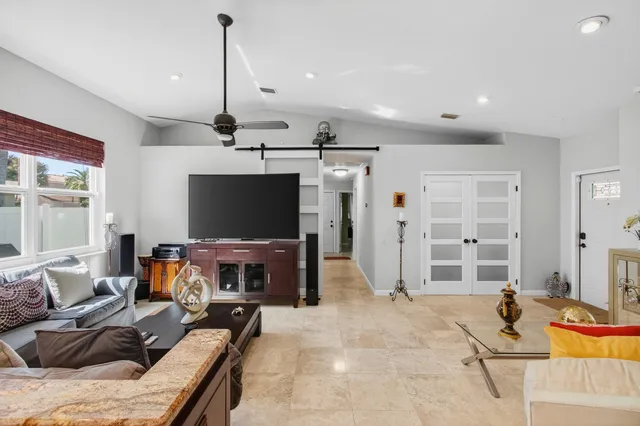 a bedroom with a large bed and a couch