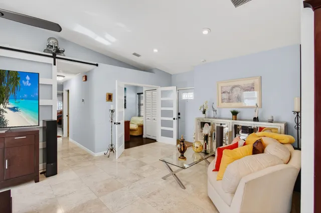 a bedroom with a bed and a couch