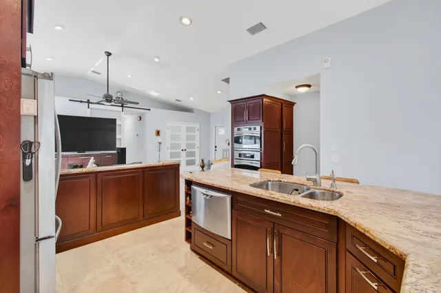 a bathroom with a shower and a glass door
