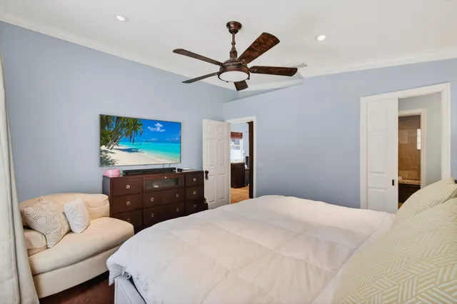 a swimming pool with barbeque oven in front of it