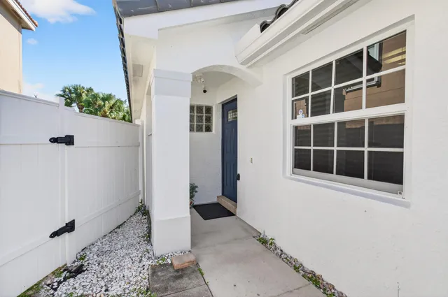 a living room with furniture ceiling fan and a rug