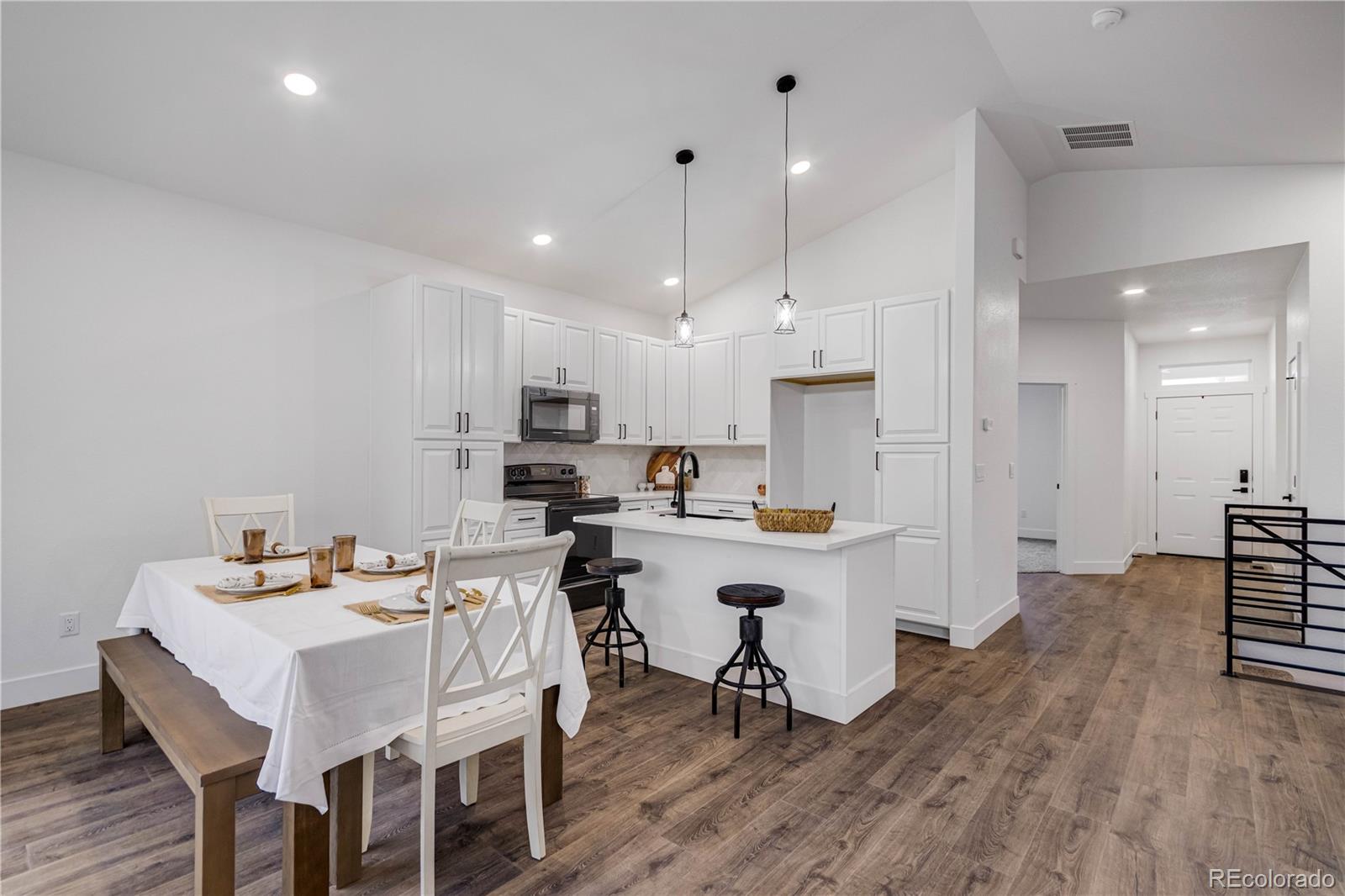 1230 Swainson Road Eaton, CO 80615 - Photo 14 of 35 a view of kitchen with cabinets table and chairs