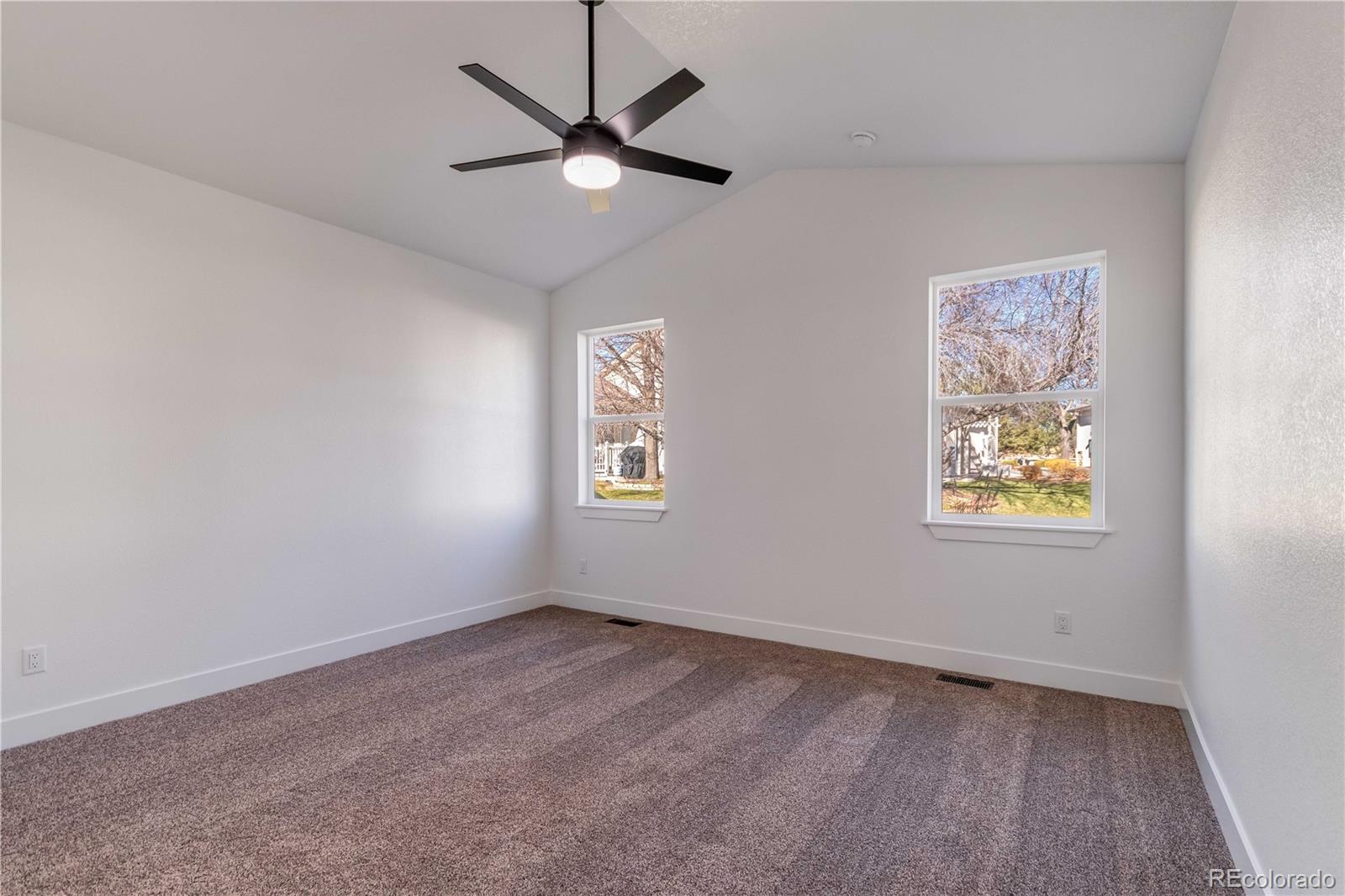 1230 Swainson Road Eaton, CO 80615 - Photo 17 of 35 an empty room with a window and a fan
