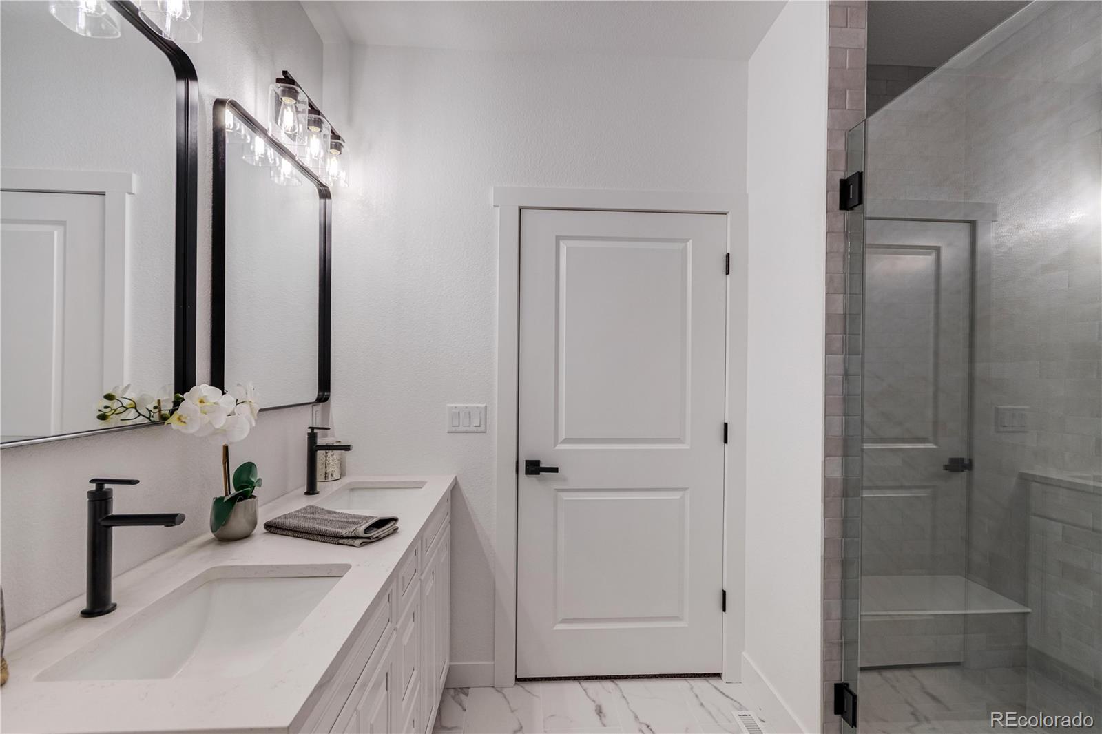 1230 Swainson Road Eaton, CO 80615 - Photo 21 of 35 a bathroom with a sink a toilet and shower