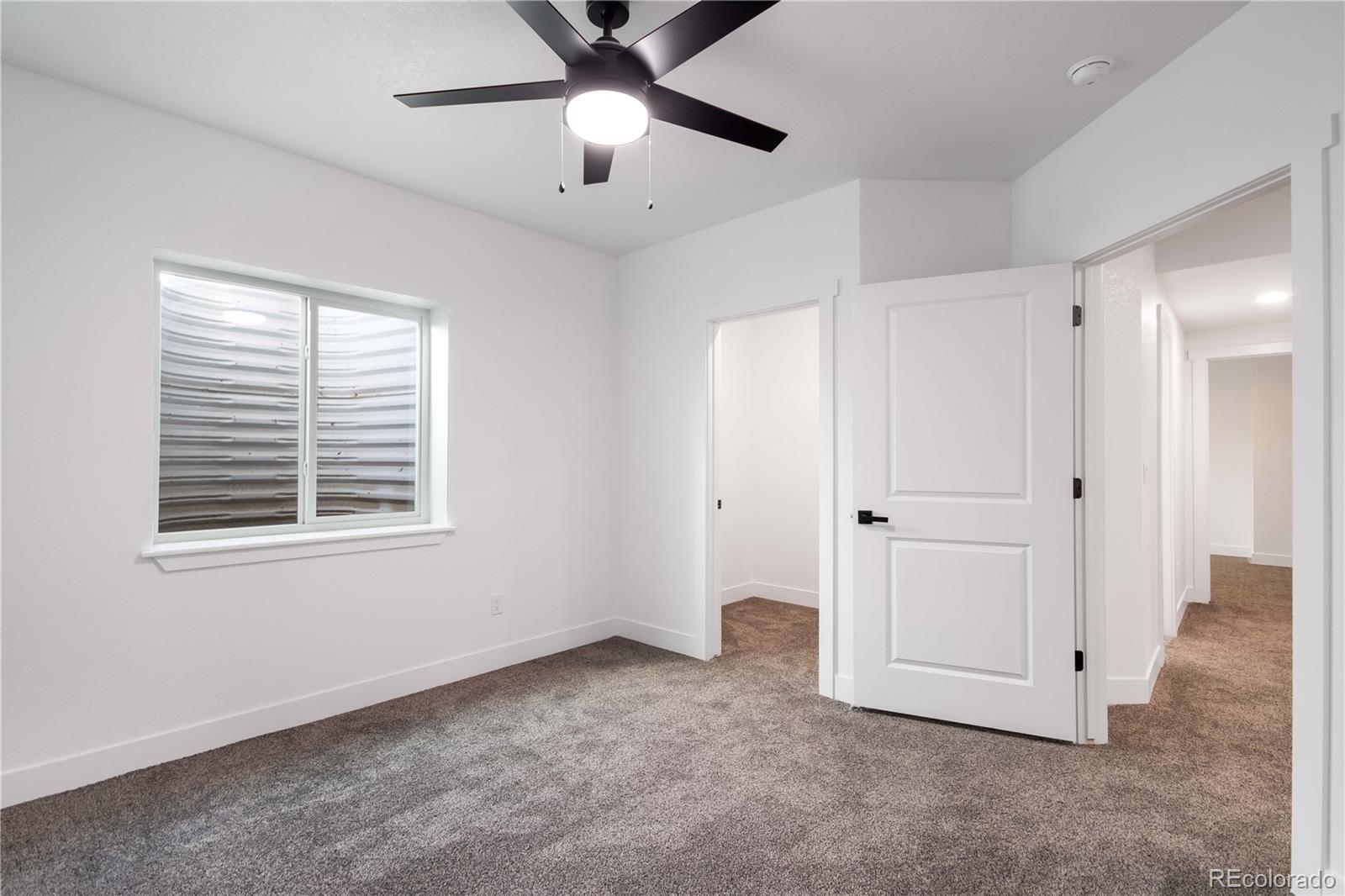 1230 Swainson Road Eaton, CO 80615 - Photo 29 of 35 a view of an empty room with a window