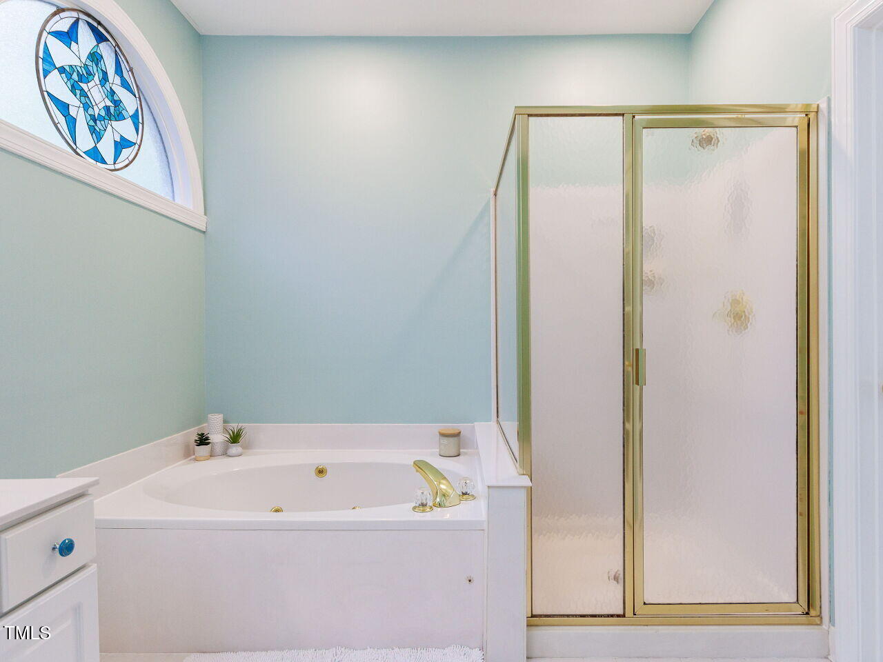 4613 Wee Burn Trail Raleigh, NC 27612 - Photo 26 of 49 Soaking tub and separate walk-in shower, half moon window.