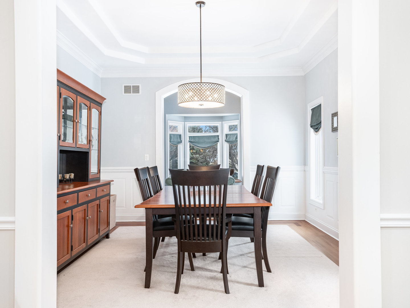 2223 Spartina Lane Naperville, IL 60564 - Photo 12 of 48 a view of a dining room with furniture window and wooden floor