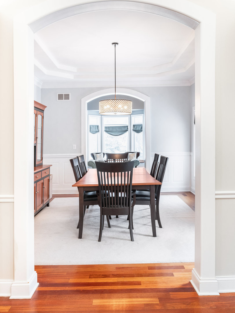 2223 Spartina Lane Naperville, IL 60564 - Photo 13 of 48 a view of a dining room with furniture window and wooden floor