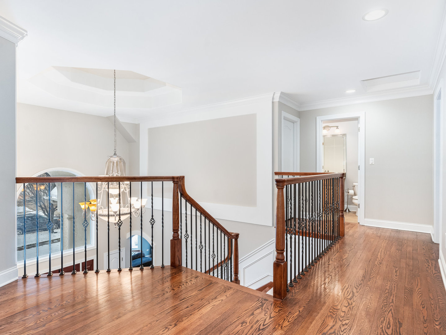 2223 Spartina Lane Naperville, IL 60564 - Photo 21 of 48 a view of a hallway with wooden floor and a window
