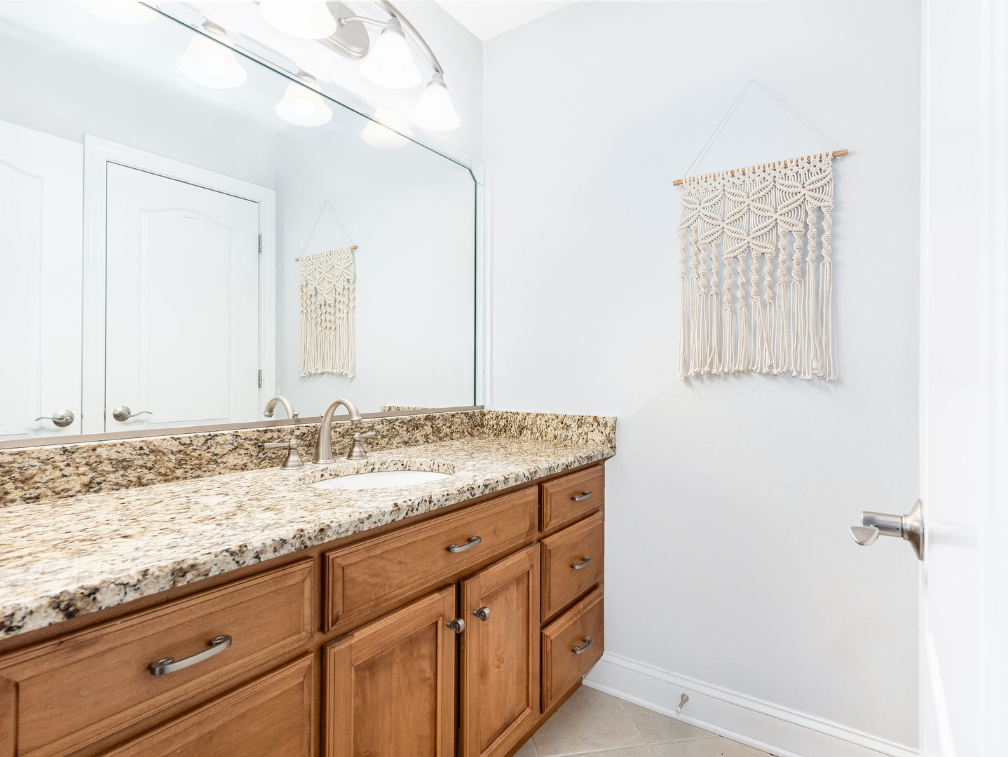 2223 Spartina Lane Naperville, IL 60564 - Photo 23 of 48 a bathroom with a granite countertop sink and a mirror