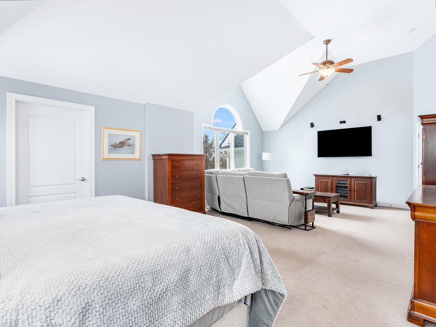 2223 Spartina Lane Naperville, IL 60564 - Photo 24 of 48 a spacious bedroom with a bed and a flat screen tv