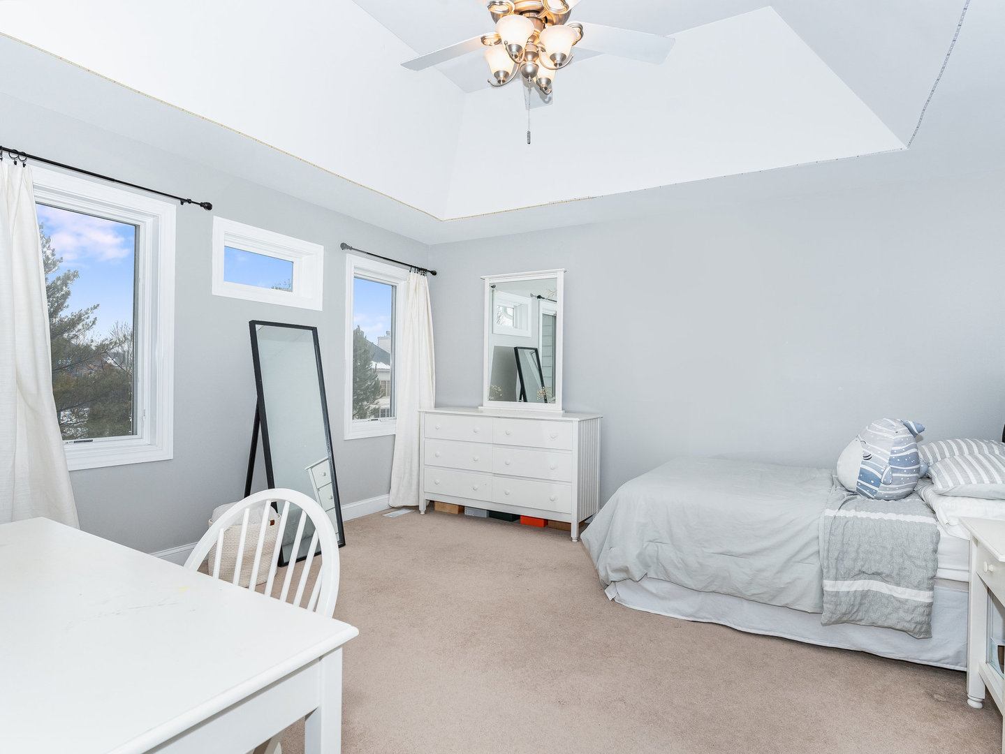 2223 Spartina Lane Naperville, IL 60564 - Photo 27 of 48 a bedroom with a bed and a chandelier