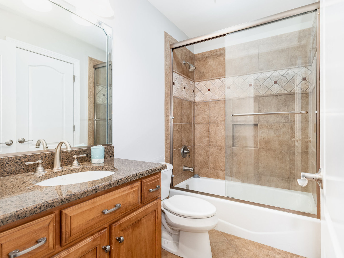2223 Spartina Lane Naperville, IL 60564 - Photo 28 of 48 a bathroom with a granite countertop sink toilet and shower