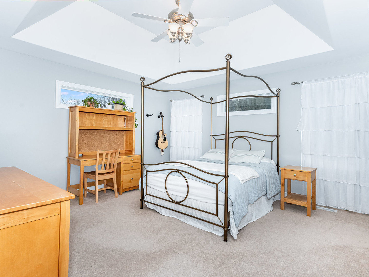 2223 Spartina Lane Naperville, IL 60564 - Photo 30 of 48 a bedroom with a bed and a chandelier