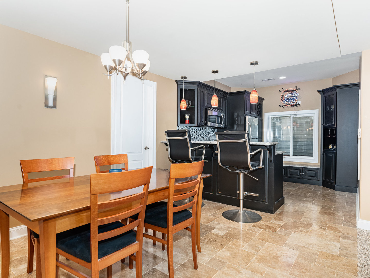 2223 Spartina Lane Naperville, IL 60564 - Photo 33 of 48 a dining room filled chandelier and kitchen view