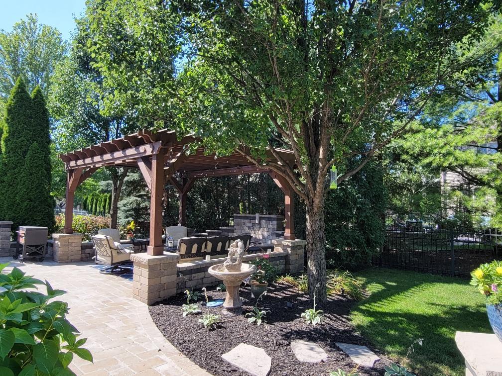 2223 Spartina Lane Naperville, IL 60564 - Photo 44 of 48 a patio with table and chairs with plants and trees