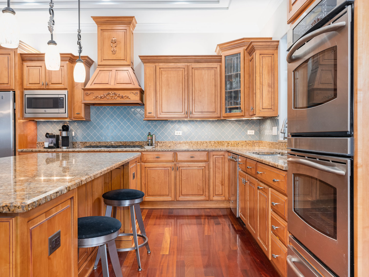 2223 Spartina Lane Naperville, IL 60564 - Photo 6 of 48 a kitchen with stainless steel appliances granite countertop a stove a sink and a microwave