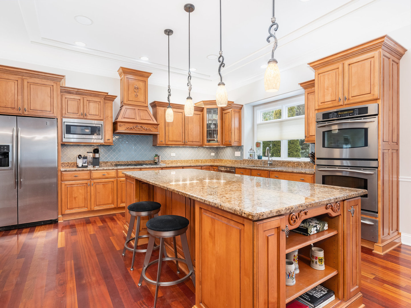 2223 Spartina Lane Naperville, IL 60564 - Photo 7 of 48 a kitchen with stainless steel appliances granite countertop a sink a stove and a wooden floors