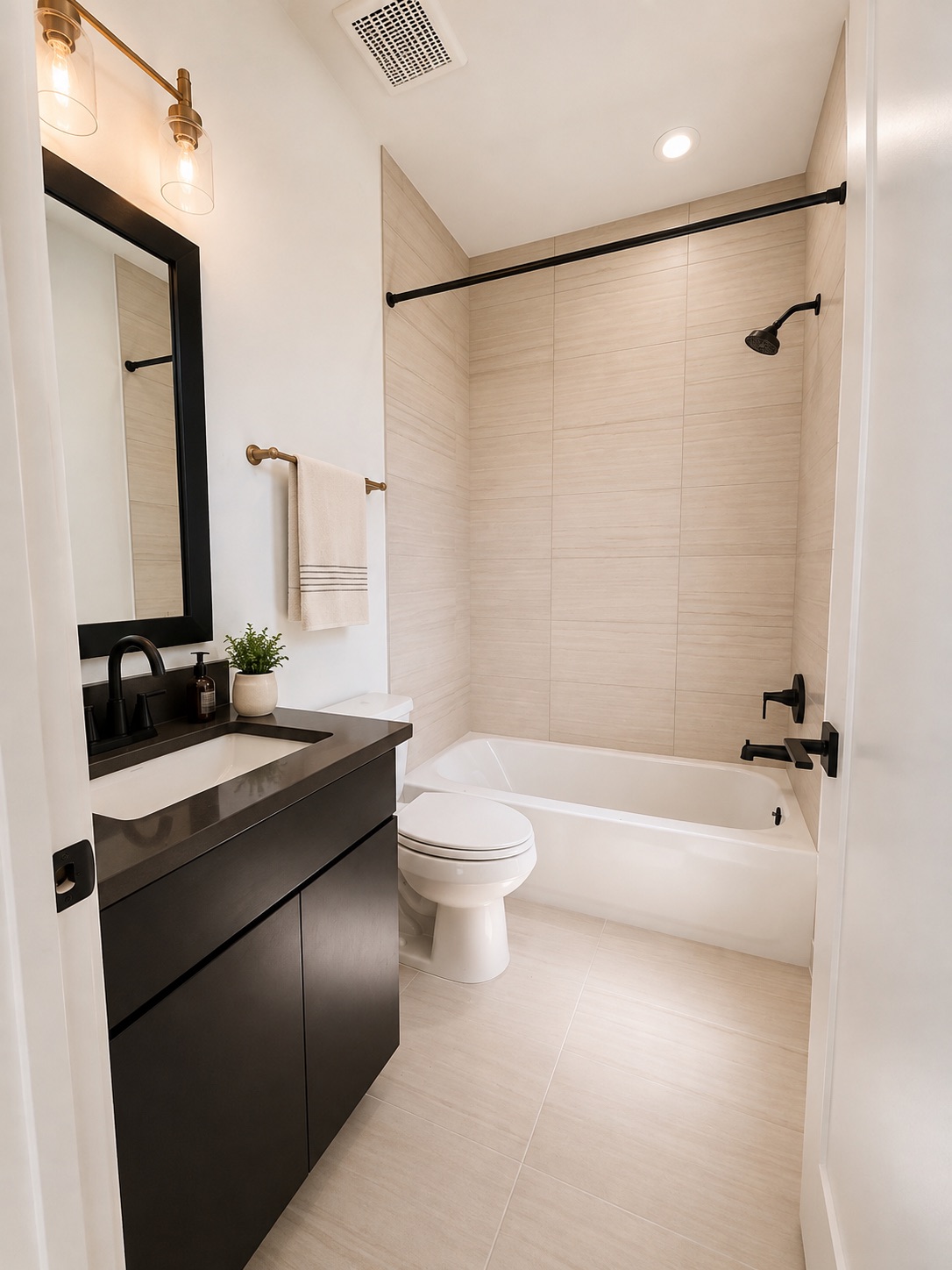 711 Paleface Ranch Road, Unit 4 Spicewood, TX 78669 - Photo 11 of 14 Modern fixtures and smooth tile accents define this functional and serene bath space.