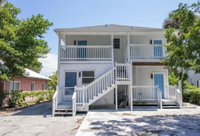a front view of a house with a porch