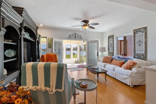 a living room with furniture fireplace and a flat screen tv