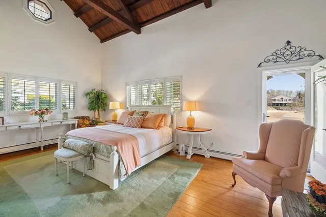 a spacious bedroom with a bed and window