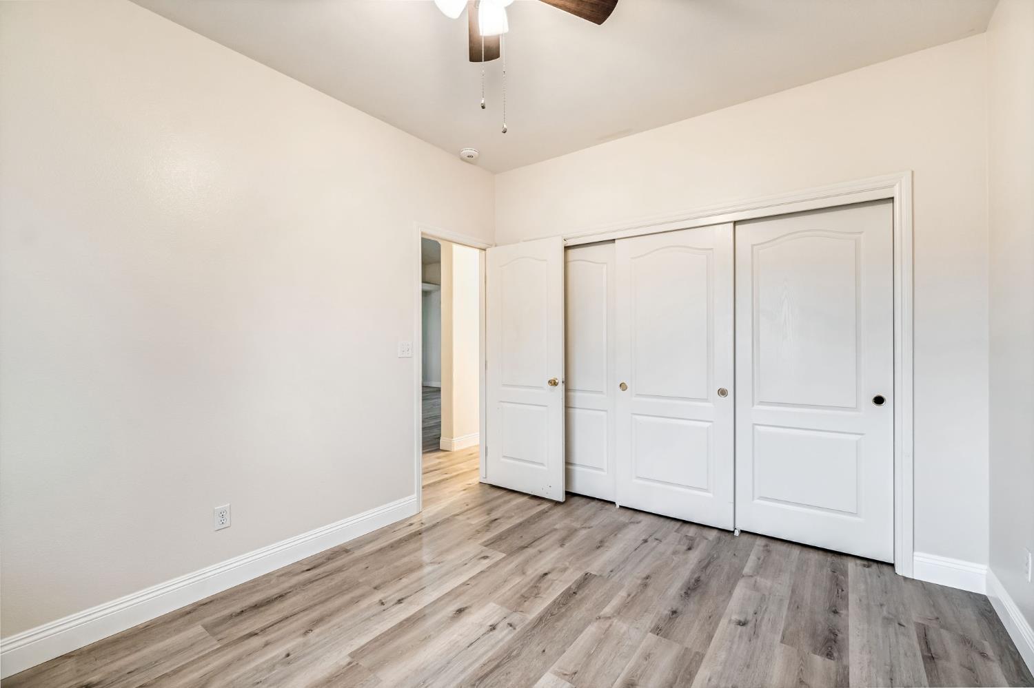 2095 Independence Place Hanford, CA 93230 - Photo 12 of 35 a view of an empty room with wooden floor