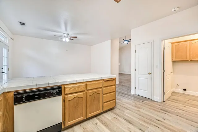 a view of a kitchen with wooden floor