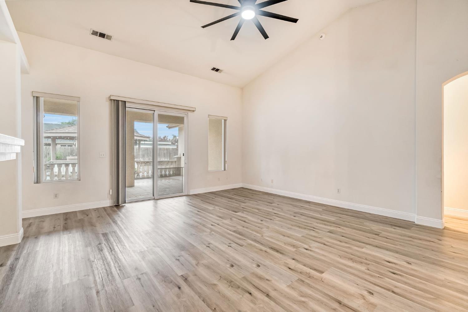 2095 Independence Place Hanford, CA 93230 - Photo 22 of 35 wooden floor in an empty room with a window
