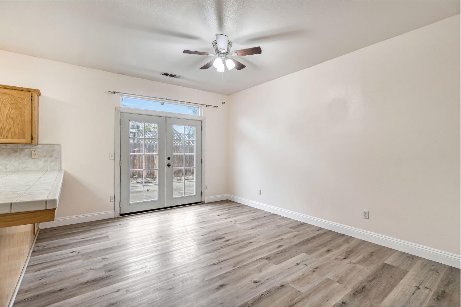 2095 Independence Place Hanford, CA 93230 - Photo 25 of 35 wooden floor in an empty room with a window