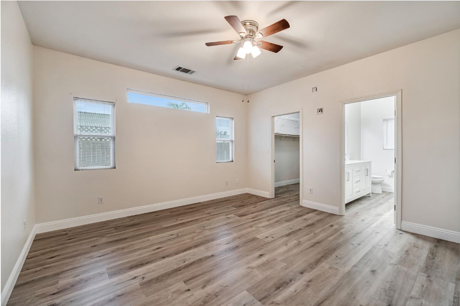 2095 Independence Place Hanford, CA 93230 - Photo 4 of 35 a view of an empty room with wooden floor