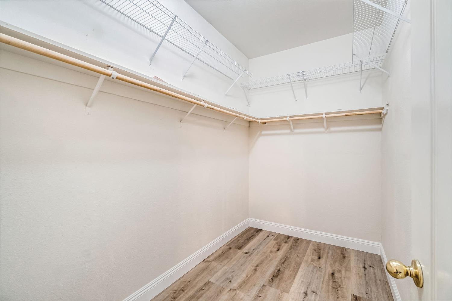 2095 Independence Place Hanford, CA 93230 - Photo 6 of 35 a view of a room with racks on the wall