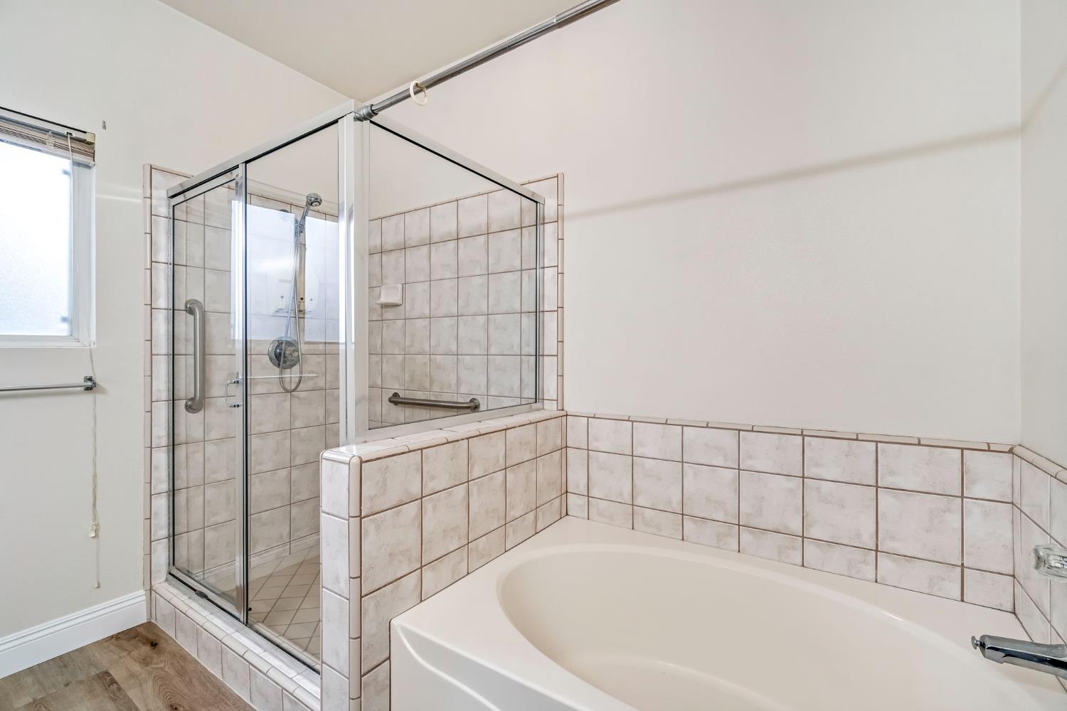 2095 Independence Place Hanford, CA 93230 - Photo 8 of 35 a bathroom with a bathtub and shower