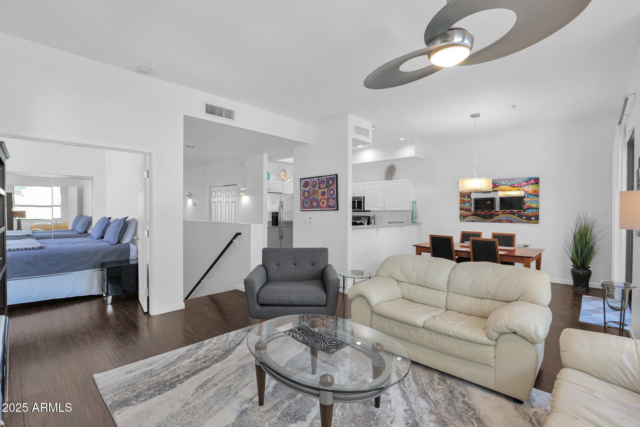 8270 North Hayden Road, Unit 2013 Scottsdale, AZ 85258 - Photo 5 of 53 a living room with furniture and a wooden floor