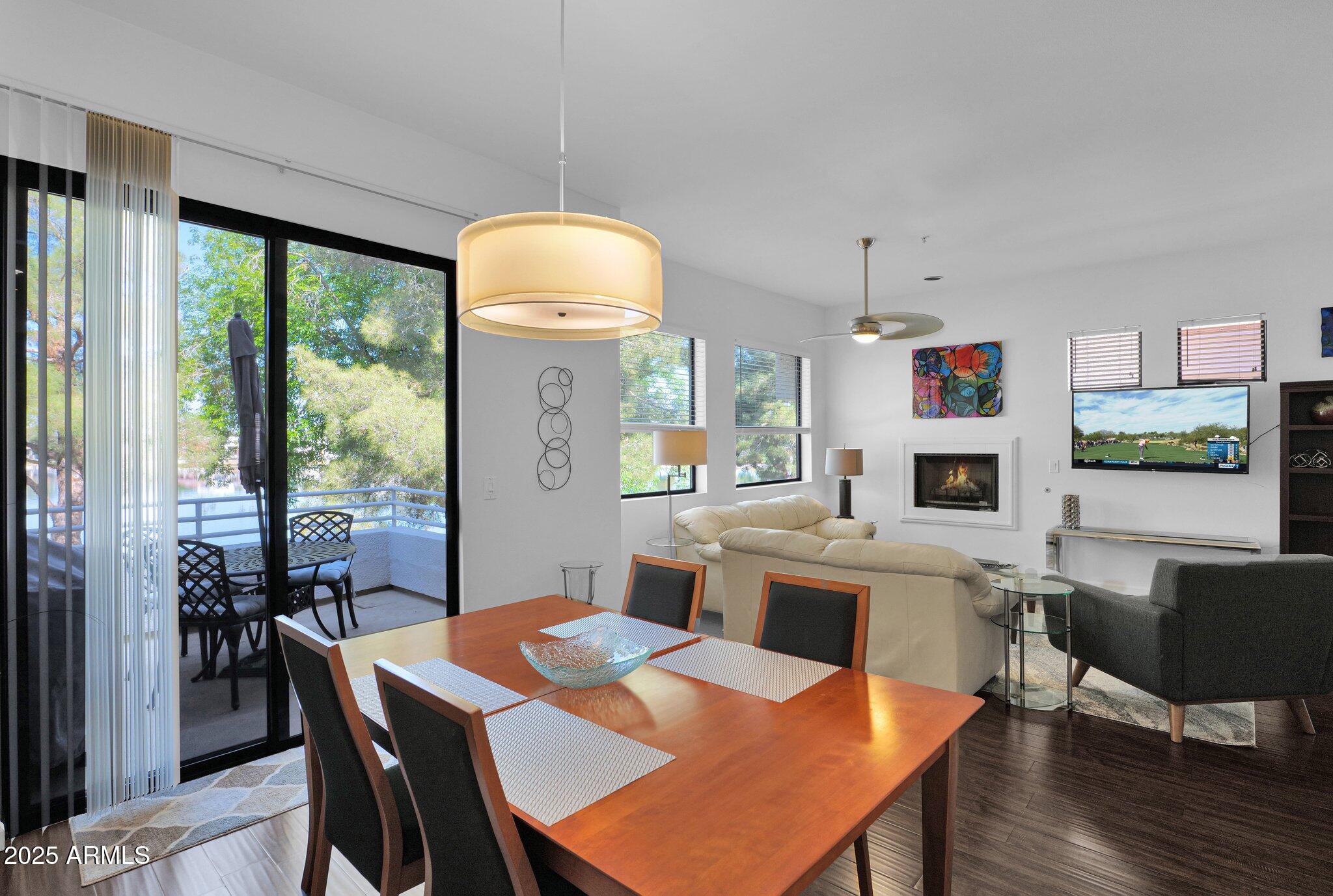 8270 North Hayden Road, Unit 2013 Scottsdale, AZ 85258 - Photo 53 of 53 a view of a dining room with furniture window and wooden floor