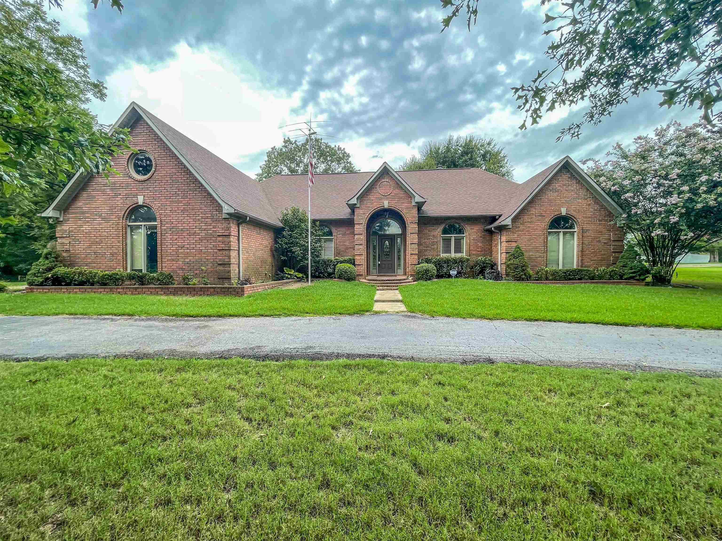 110 Fisherville Road Collierville, TN 38017 - Photo 1 of 21 a front view of a house with a garden